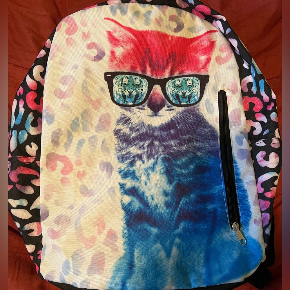 Cat with Tiger sunglasses and pink leopard print backpack